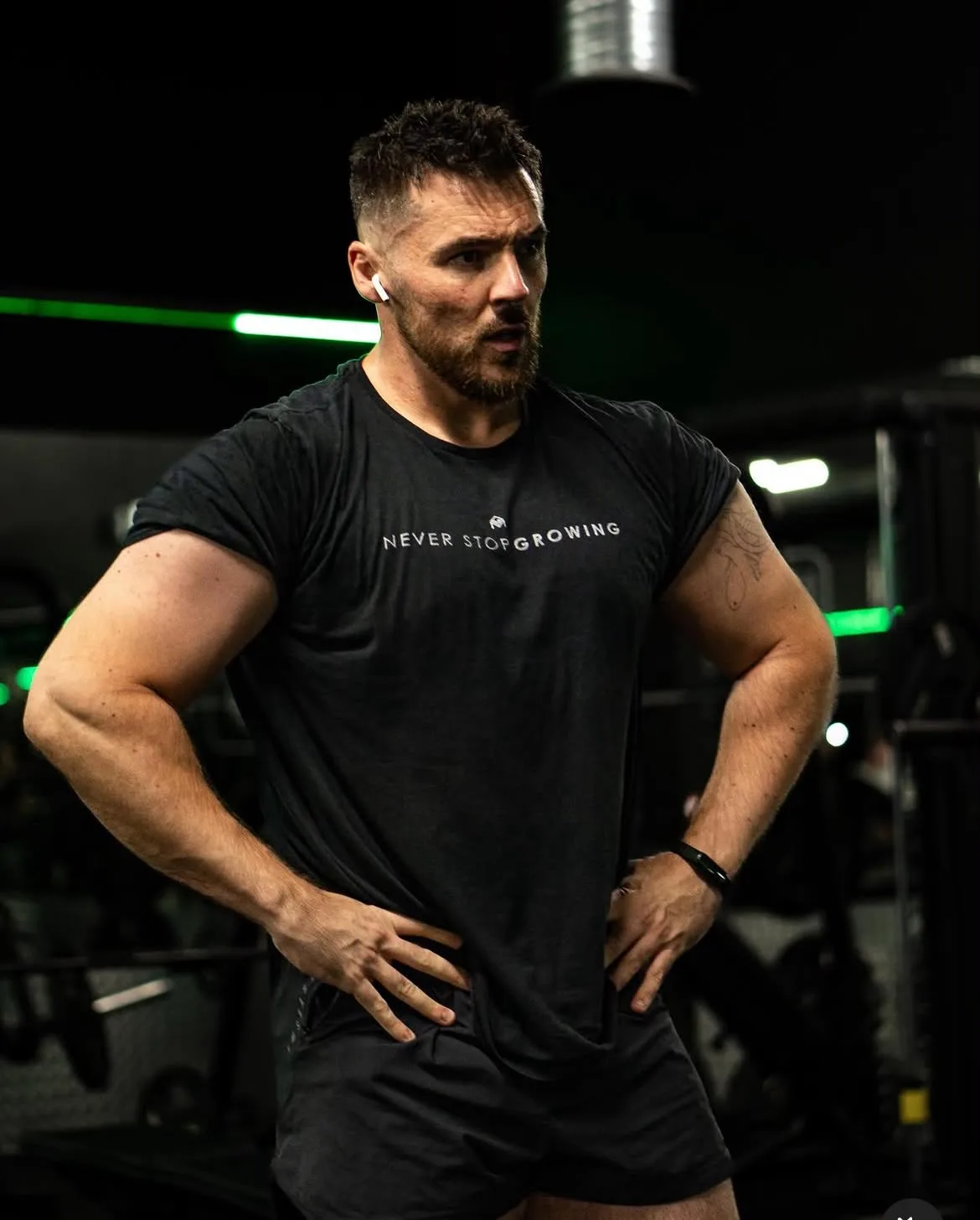 Dan on the gym floor between sets