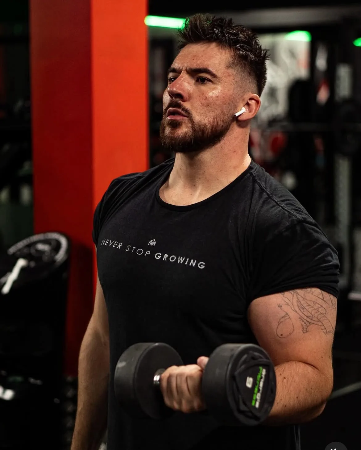 Dan demonstrating a dumbbell curl